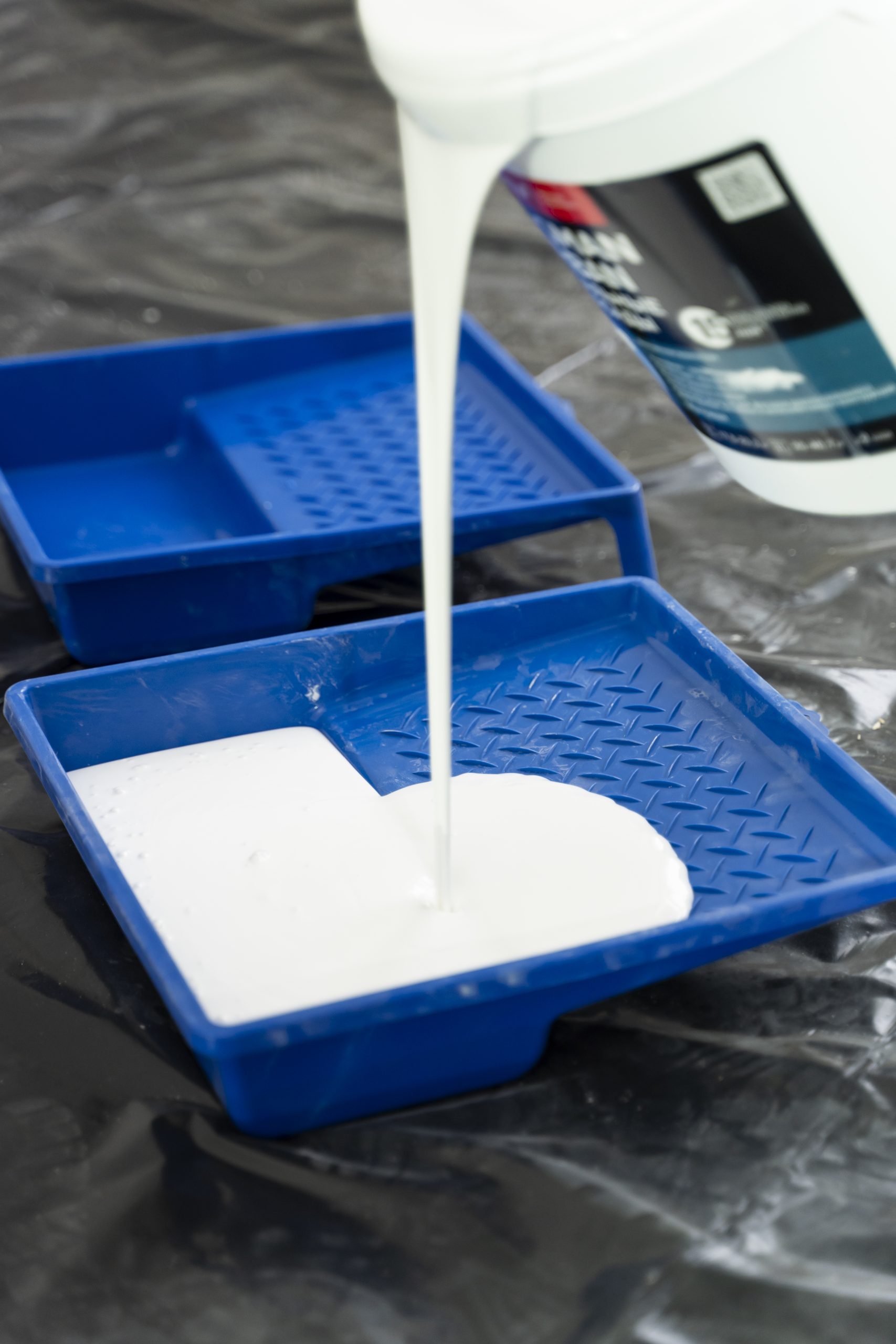 high-angle-paint-pouring-from-bucket